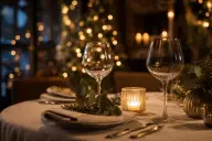 Candlelit table set for two people sharing a festive meal